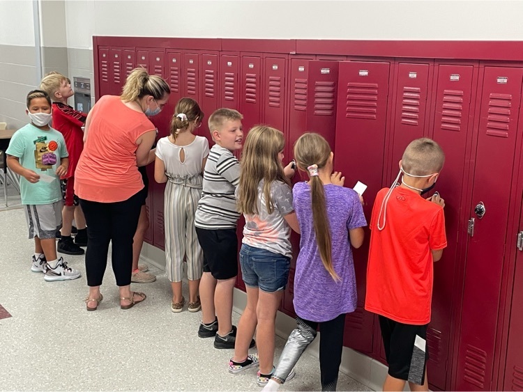 Intermediate School students practice opening their lockers.