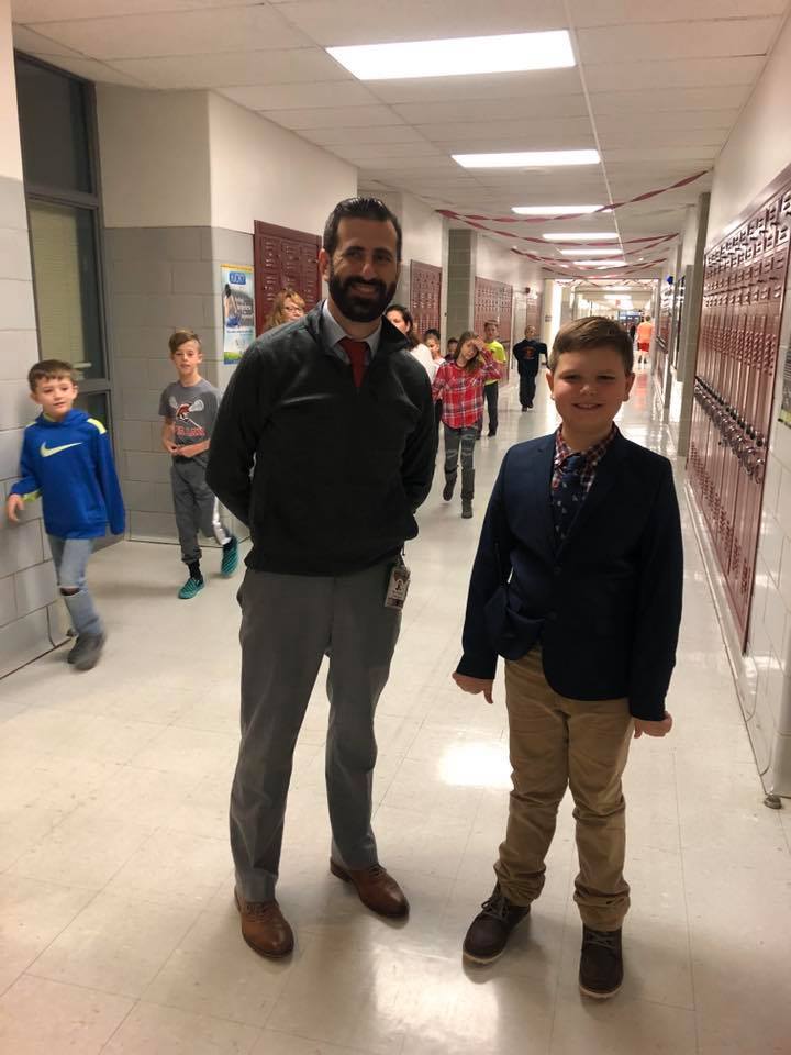 Mr. Farina poses with a student on twin day who dressed as him. Please note: photos were taken prior to pandemic and masking mandates.