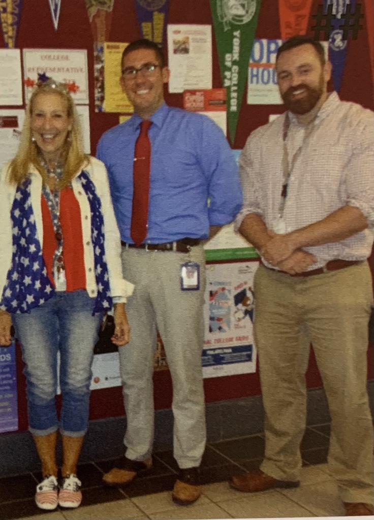 Mr. Dziunycz poses with Mrs. Moll and Mr. Furman. Please note: Pictures were taken prior to pandemic and masking mandates.