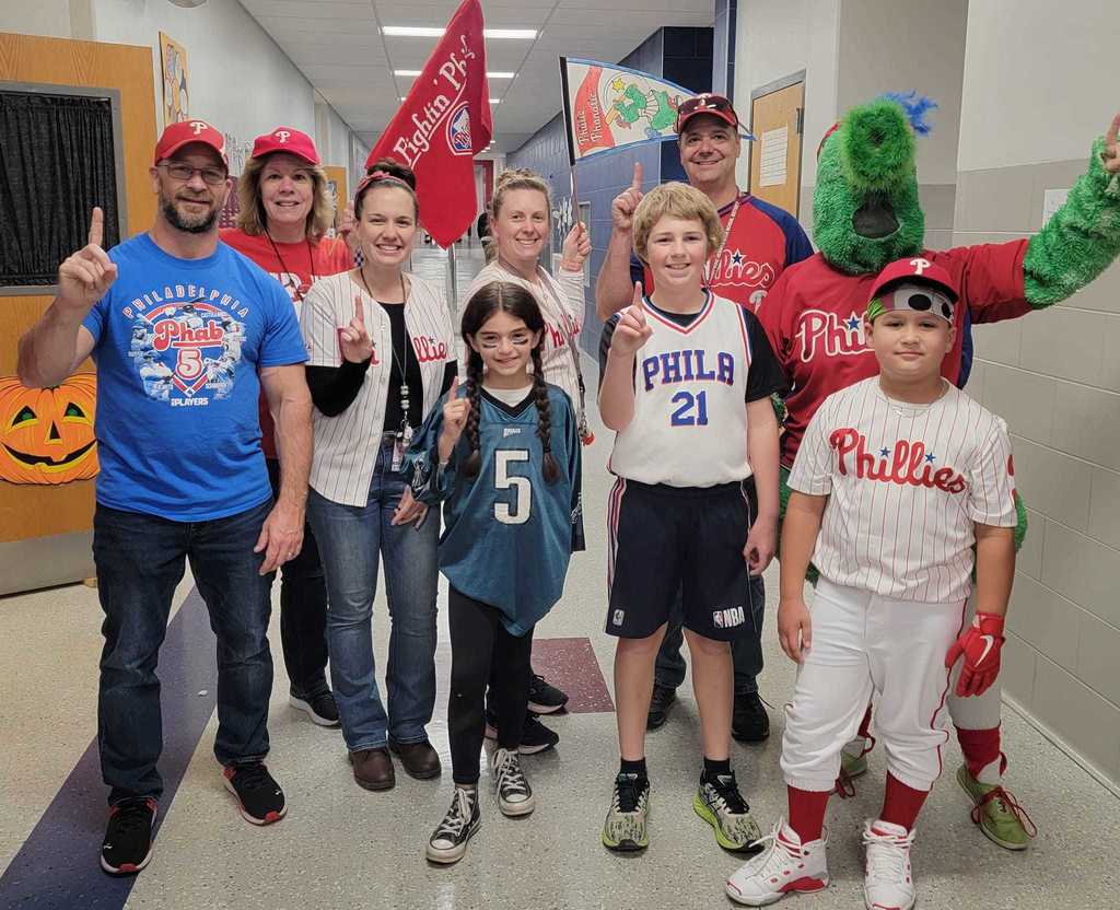 Mrs. Ward celebrating with students as the Philly Phanatic