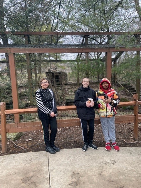 Natalina, Maysen, and Ty'Sheen with the bobcat
